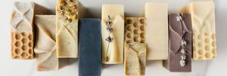 All Blissed Botanical Co Everyday Bliss cold process soaps in a line